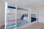 bunk room with 4 queen beds. Sleeps 8